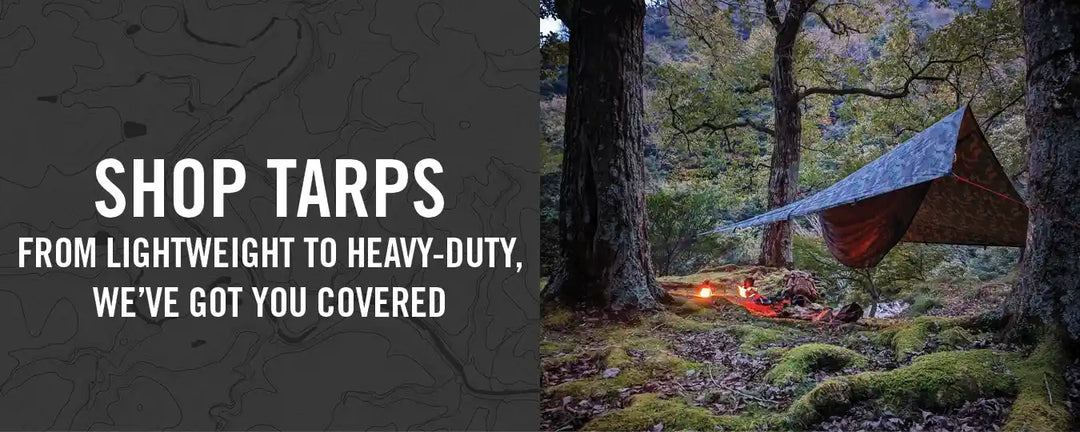 A camo tarp in the woods, shop tarps from lightweight to heavy-duty, we've got you covered.
